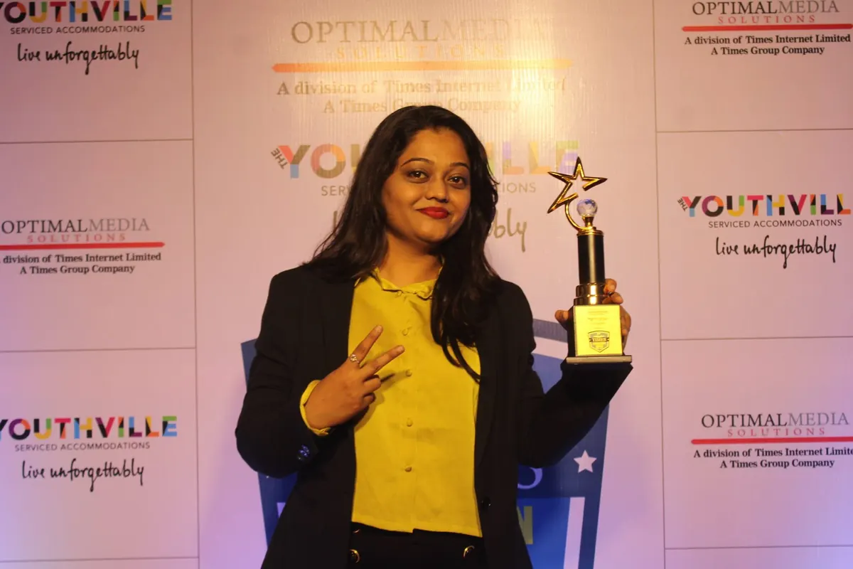 ProfitMax mentor with the Times Education Icons 2023 trophy